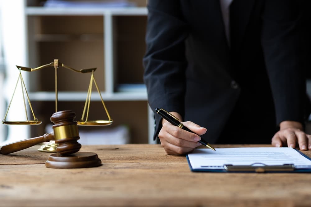 Lawyer working on paperwork in the office. 