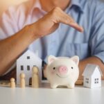 Real estate attorney hands over piggy bank for protection and care.