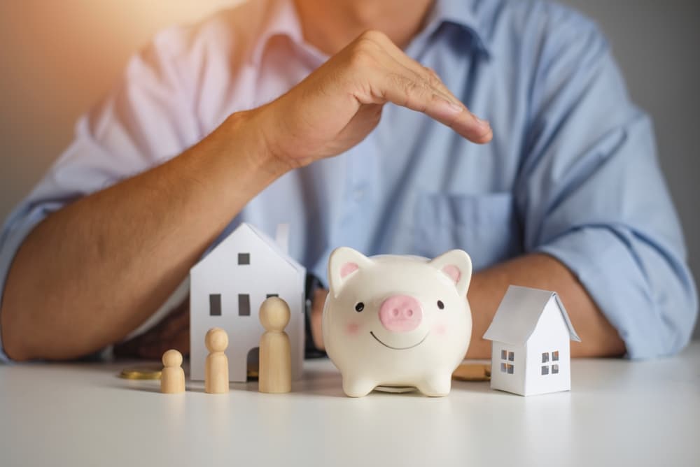 Real estate attorney hands over piggy bank for protection and care.