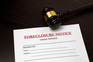 Foreclosure notice and gavel. Housing crisis, loan default 