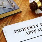 Property Tax Appeal documents and wooden gavel.